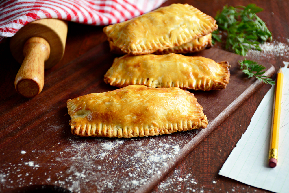 Three hand pies on a cutting board