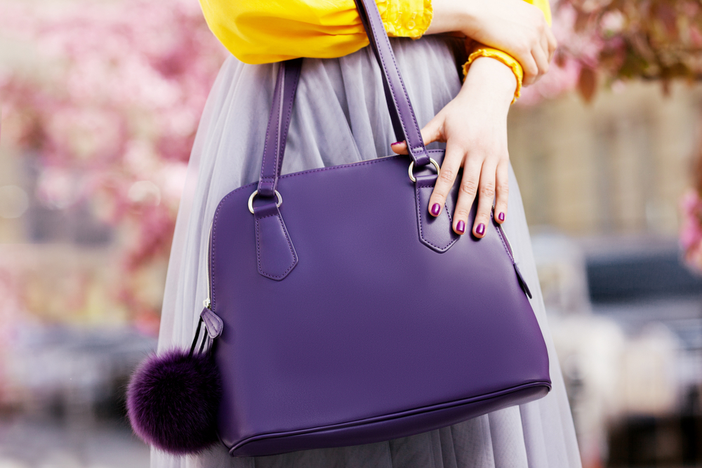 woman holding large bag